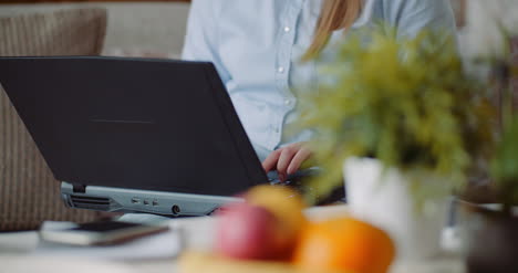 Businesswoman-Writing-Email-On-Laptop-Computer