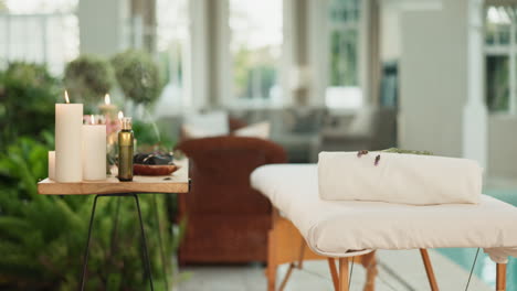 relaxing spa setting with massage table and candles