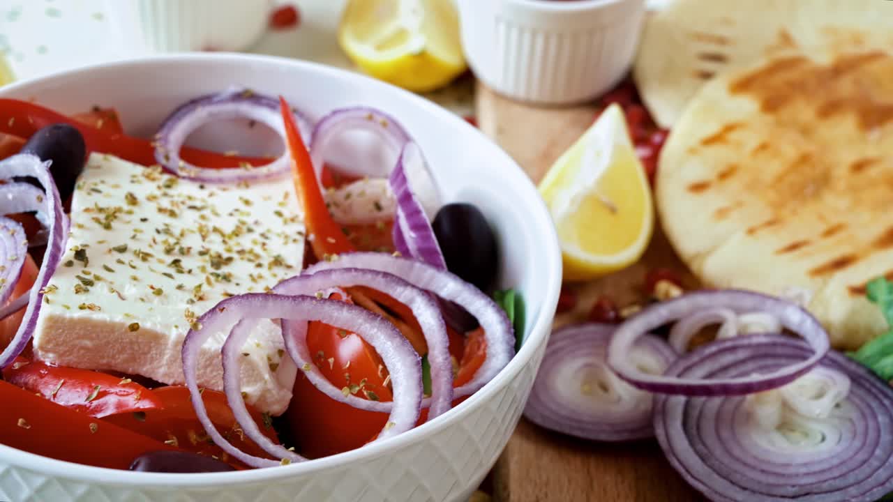 Close-up view of a table full of healthy national food in dishes. Sliced vegetables, salads and appetizers