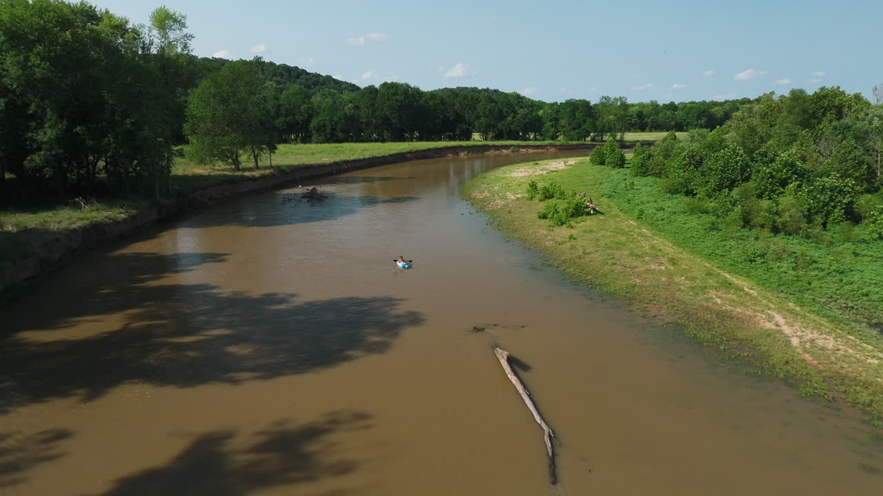 Aerial Towards Murky River With Kayak Boat In Illinois In Arkansas, United States