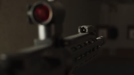 close up of ar 15 assault rifle being aimed down range