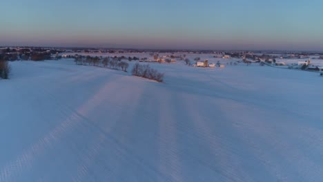 Aerial-View-of-Early-Morning-Sunrise-After-a-Snow-Fall-in-Amish-Countryside-as-Senn-by-s-Drone