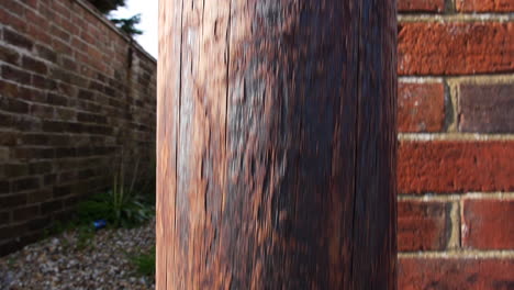 camera rising up a telegraph pole with a danger sign at the top