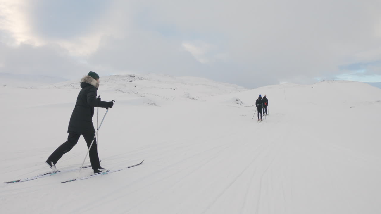 Group of cross country skiers on a mountain on a ski trail in the winter nature of Sweden.