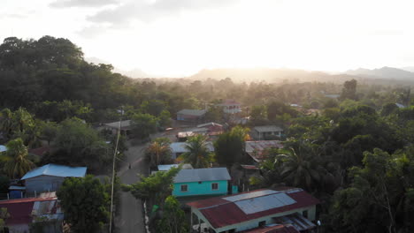 A-drone-shot-of-the-late-afternoon-sun-shining-over-a-small-Central-American-village
