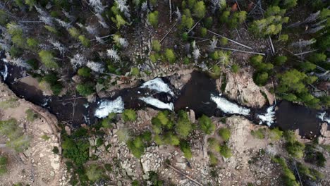 Aerial-drone-top-bird's-eye-view-rising-shot-of-the-beautiful-Provo-Falls-waterfall-in-the-Uinta-Wasatch-Cache-National-Forest-in-Utah-on-a-overcast-summer-evening