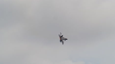 jet engine exhaust f-22 raptor fighter jet in a sharp turn track