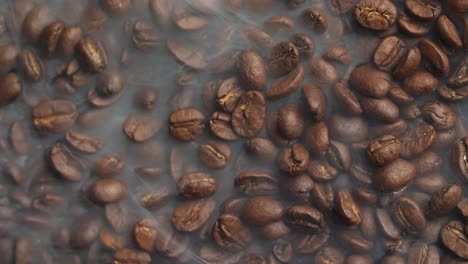 smoke with roasted coffee beans , video in 4k, 50fps