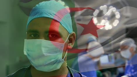 animation of waving algeria flag over portrait of biracial male surgeon in surgical mask at hospital