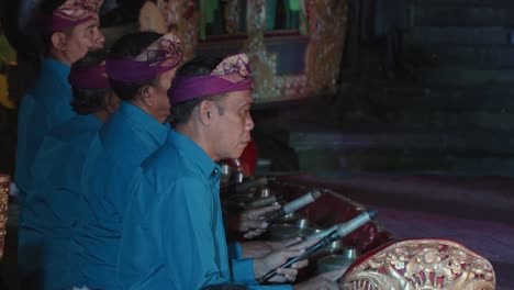 musicians play on gangsa metallophones during legong and ramayana traditional theater dance performance at ubud palace, bali