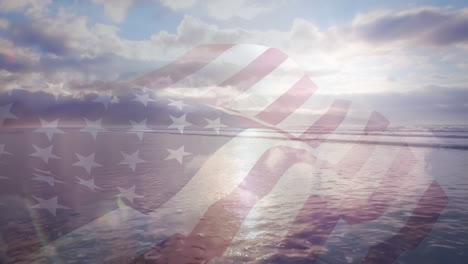 Digital-composition-of-waving-us-flag-against-aerial-view-of-the-beach-and-sea-waves