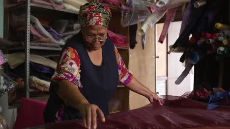 Mixed-race-woman-working-at-a-hat-factory