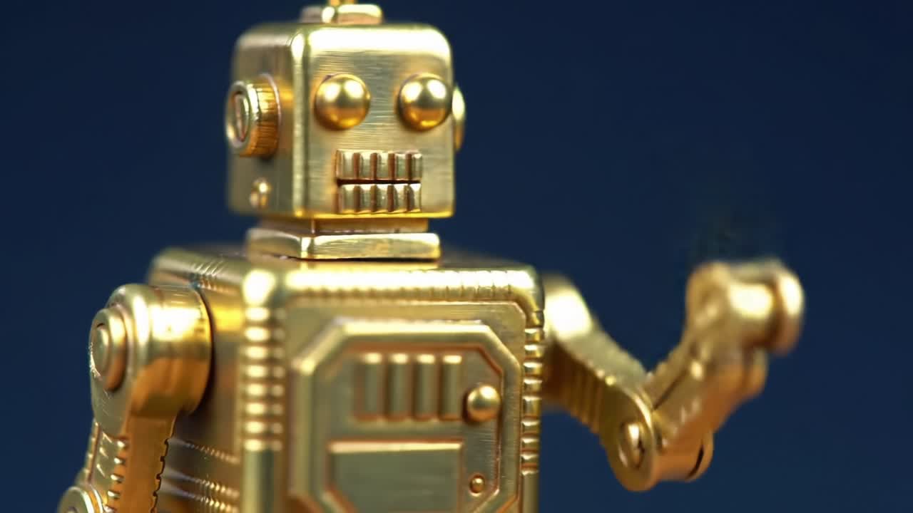 A Detailed Look at a Vintage Golden Robot Toy, Showcasing its Unique Design and Features in a Captivating Display Against a Blue Background