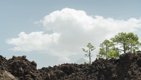 Pico-Del-Teide-volcano-in-background-and-clouds-rolling-over,-time-lapse-shot