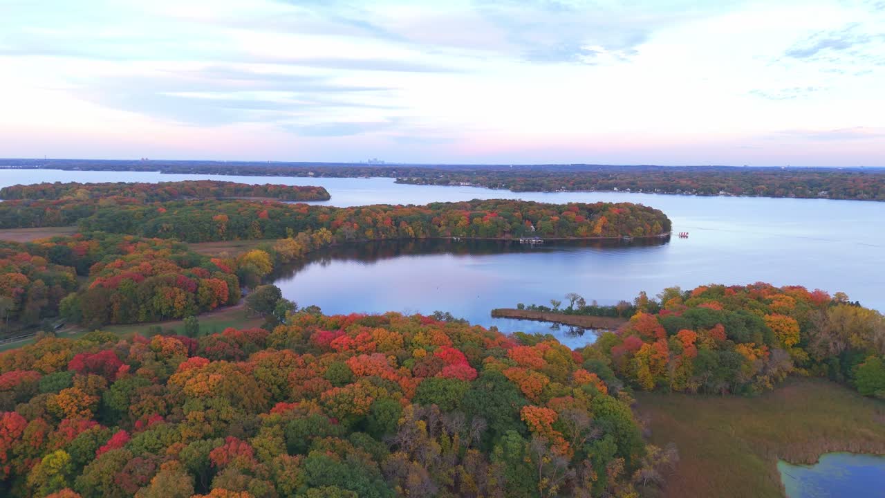 Autumn spreads across the shores of Lake Minnetonka, with aerial views revealing a mosaic of trees and water