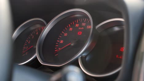 close-up of a car dashboard with speedometer and gauges