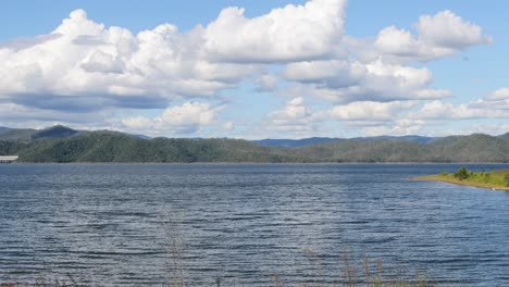 timelapse of a tranquil lake with changing clouds