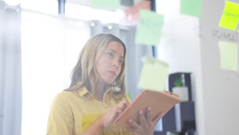 woman, tablet and thinking in planning