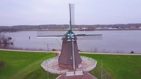 aerial over a dutch windmill in fulton illinois along the mississippi river