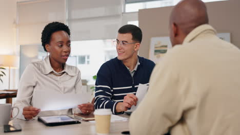 business meeting with diverse professionals discussing documents in the office