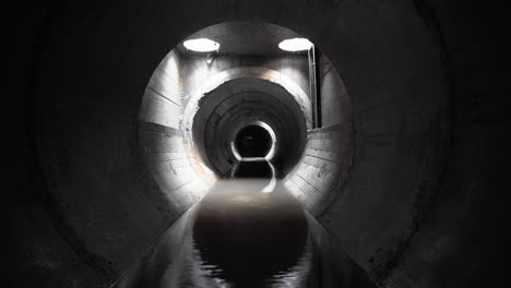 new concrete drainage rainwater collector, in a concrete pipe, inside view.