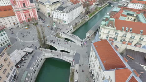 Aerial-view-of-Tromostovje,-Triple-Bridge-of-Ljubljana-on-the-river-Ljubljanica,-center-of-the-city