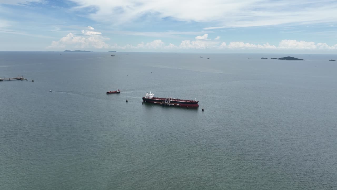 Industrial ship in the ocean in Thailand. Commercial industrial shipping. Aerial drone view.