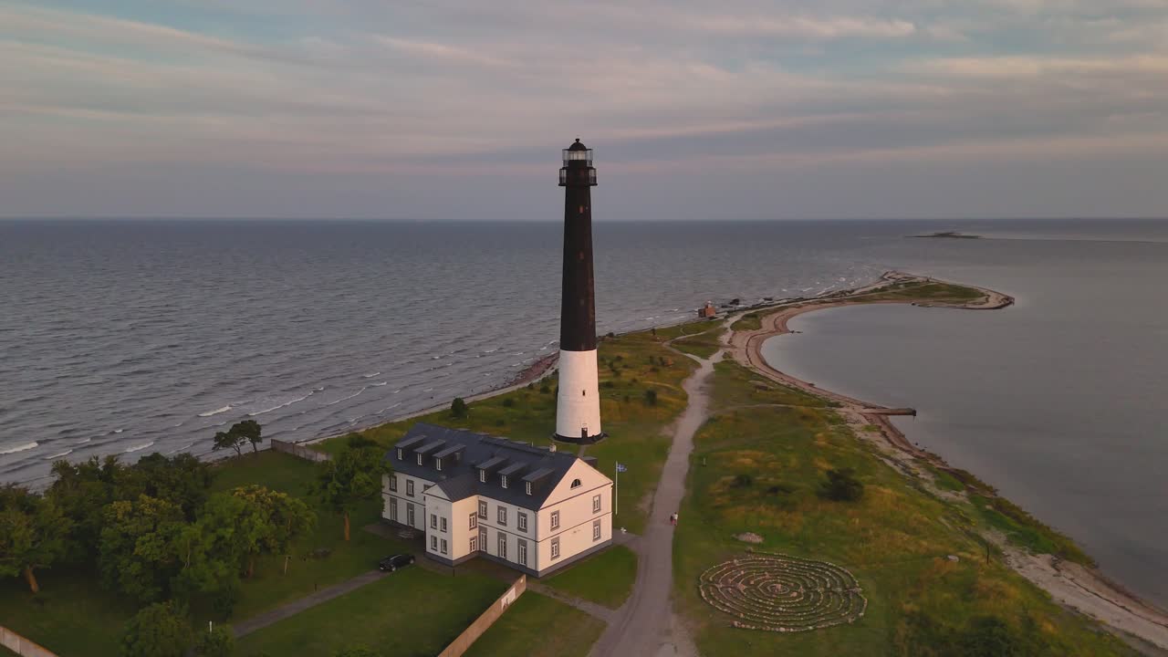 Aerial drone view around the lighthouse at Sõrve, Saaremaa island in Estonia.
