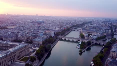 flying over seine river towards ile de la cite at sunrise