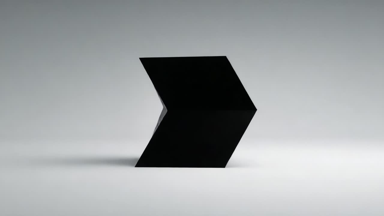A Minimalist Black Geometric Sculpture Transitions Through Motion, Displaying Unique Form and Contrast Against a Neutral Background in Two Distinct Frames