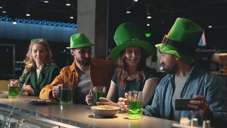 friends celebrating saint patrick's day in a pub 6