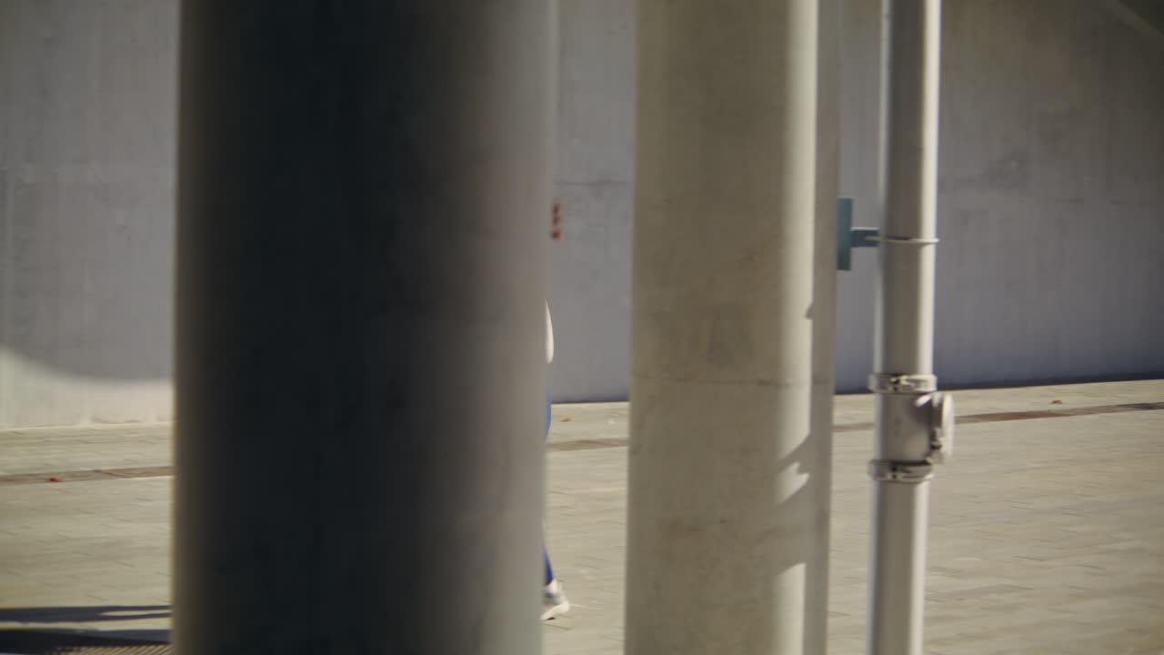 Couple running together outdoors in urban setting