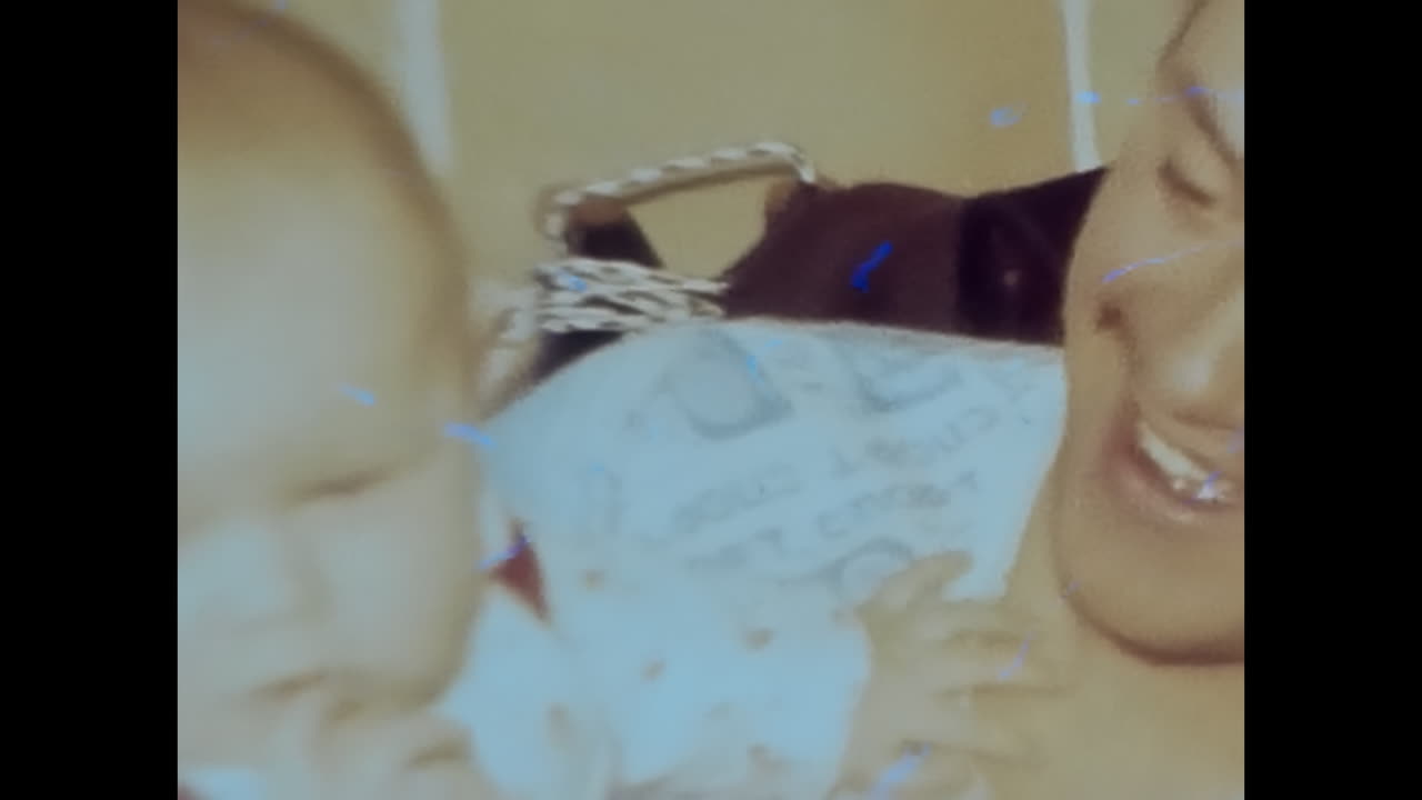 Soviet Man Holding Baby, Heartwarming Moment Captured in Archival Video. CIRCA USSR 1980s: A touching video captures a Soviet man embracing a baby in a heartwarming display of love and tender care.