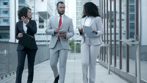 focused colleagues discussing business questions