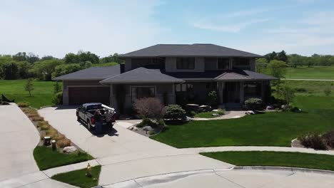 drone push in on a home improvement crew getting out of a truck with tools