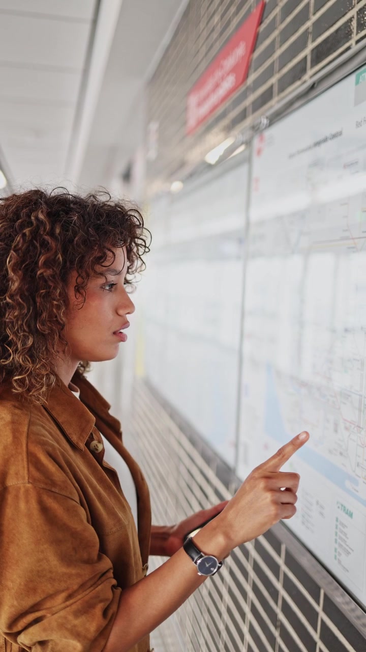Smiling Woman Planning Route Using Public Transport Map and Phone