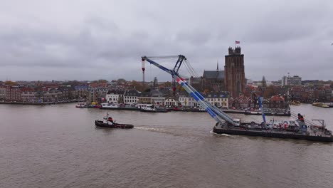 side-on perspective, the tugboat and crane create captivating scene