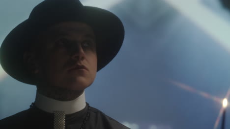 young priest with candle