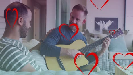 animation of heart icons over diverse gay couple smiling and playing guitar