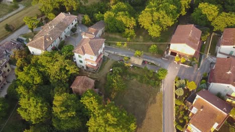 drone view of some houses during a sunset in the italian countryside