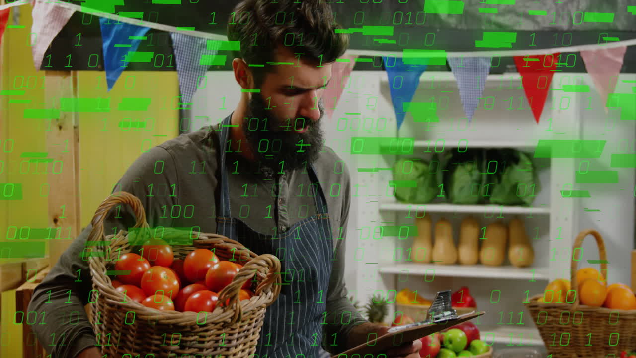 Man holding basket of tomatoes with digital data animation overlay