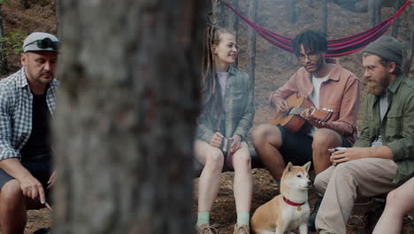 friends camping and making music