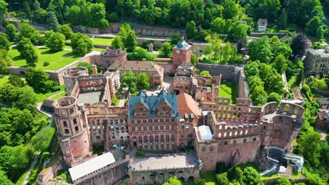 4k aerial drone video of the historic castle on königstuhl hill overlooking heidelberg, germany