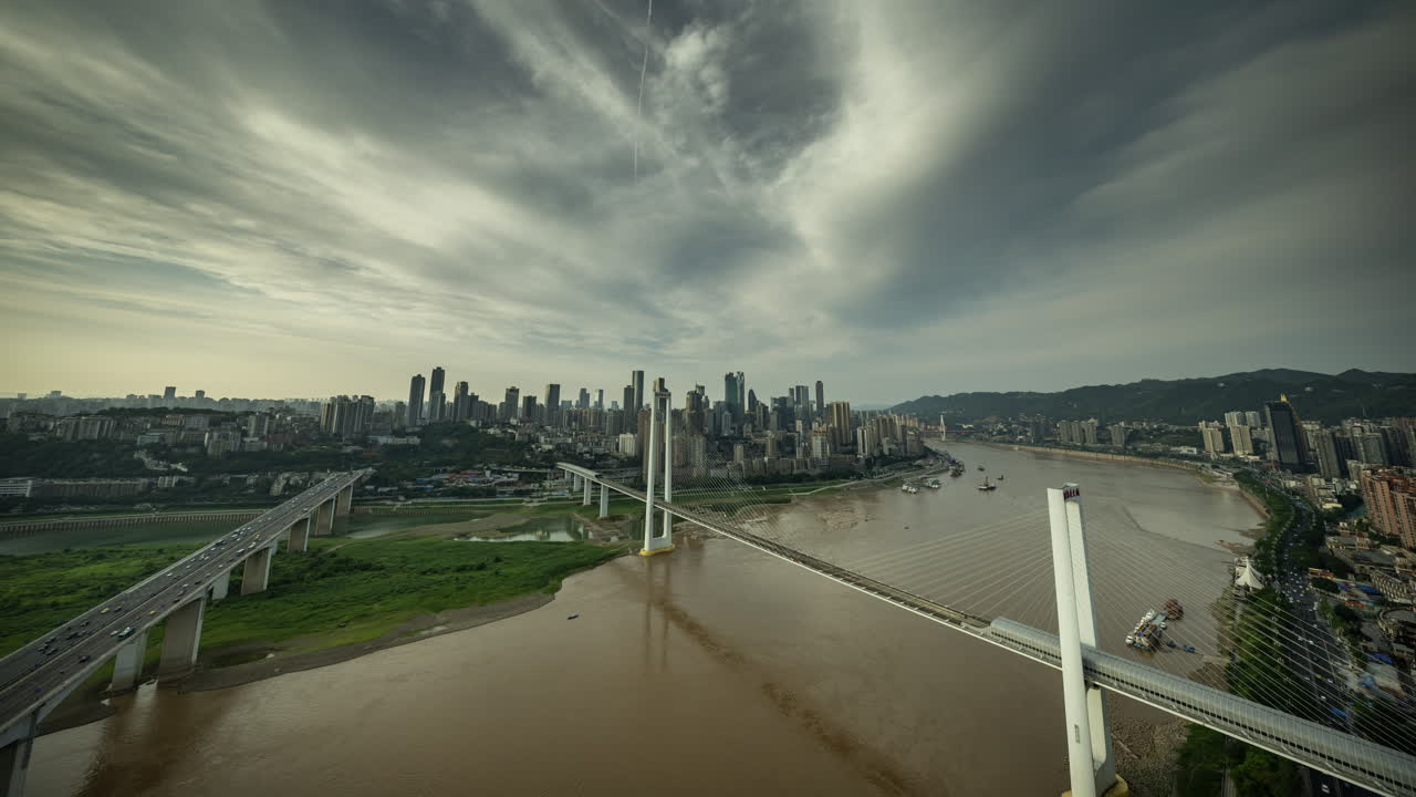 CHONGQING, CHINA - 28 MAY 2025 : Timelapse of the amazing Chongqing cyberpunk city skyline from a high vantage point with the yangtze river