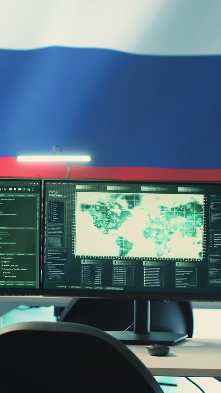 Dual Computer Monitors Displaying Programming Code and World Map Data
