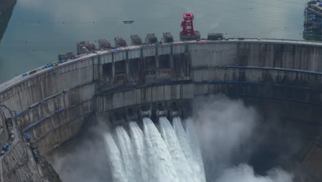 drone footage of a super large dam releasing water baihetan