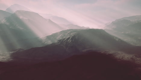 alpine chains shrouded in the morning fog