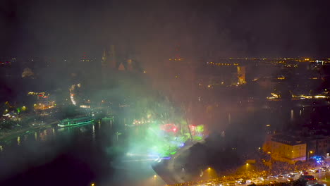 Fireworks-over-Wawel-Royal-Castle-and-Vistula-river-in-Krakow-during-Dragon-Parade,-Poland