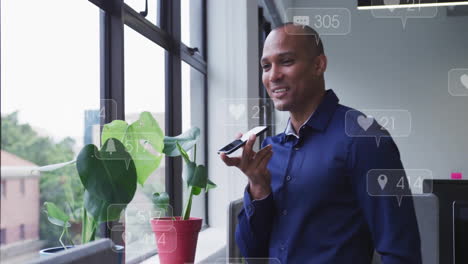 animation of data processing over biracial businessman talking on smartphone in office