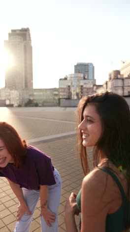 two young women taking selfie in city